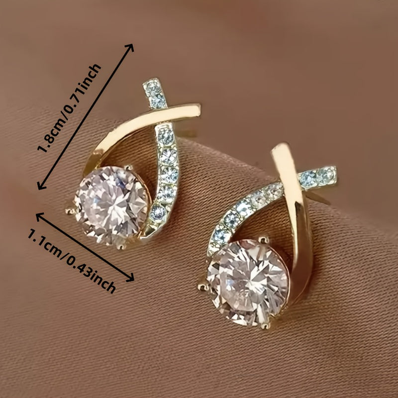 Boucles d'oreilles à puce avec croix dorée et zirconiums