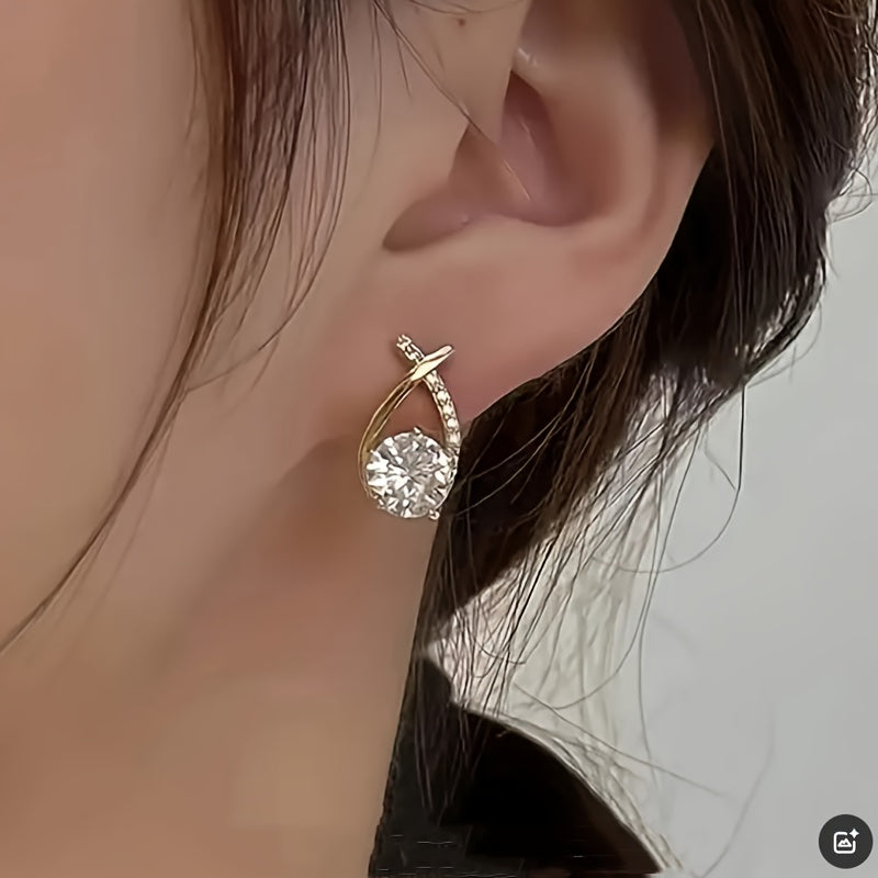 Boucles d'oreilles à puce avec croix dorée et zirconiums