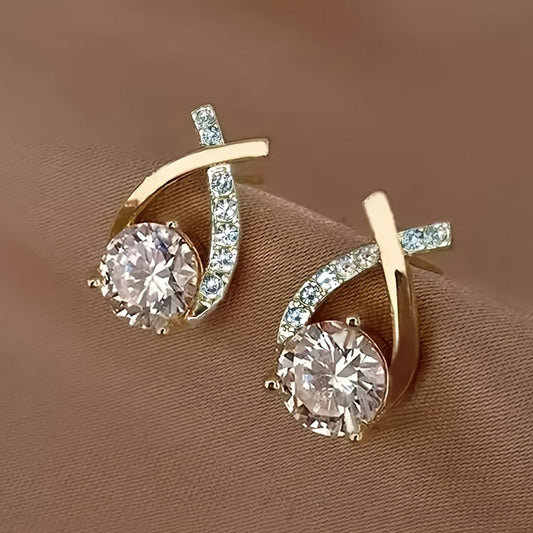 Boucles d'oreilles à puce avec croix dorée et zirconiums