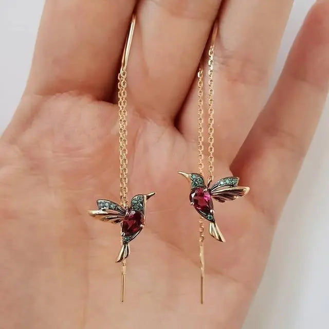 Boucles d'oreilles en fil avec colibri en or et cristaux